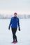 Portrait of a smiling young female sportswoman in winter ice river