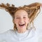 Portrait smiling young girl teen with flying curly hair