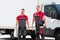 Portrait Of A Smiling Young Male Technicians Holding Tool Box