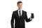 Portrait of a smiling young man in a suit showing a smartphone