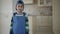 Portrait smilling African American boy in a in blue uniform looking into the camera.