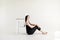 Portrait of smilling girl sitting with chair,  on a white background