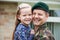 Portrait Of Soldier On Leave Hugging Daughter