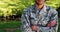 Portrait of soldier standing with arms crossed in park