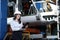 Portrait of a solid businesswoman holding tablet , controlling work process in a airplane factory