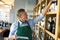 Portrait of sommelier taking inventory in wine store