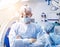 Portrait of spinal surgeon in operating room with surgery equipment.