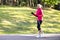 Portrait of Sportive Senior Woman Doing Nordic Walking in Park