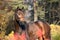 Portrait of sportive warmblood horse at pine trees background. a