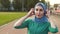 Portrait sports Muslim girl in headphones at the stadium