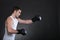 Portrait sportsman boxer in studio dark background