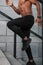 Portrait of sportsman running up stairs