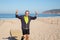 Portrait of sporty aged man spending time on sea beach