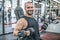 Portrait of sporty healthy strong muscle charismatic happy smiling handsome man bodybuilder hard training workout in well-equipped