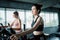 Portrait of sporty woman exercising elliptical in fitness gym., Group of pretty women in sportswear working out cardio training at