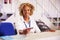 Portrait Of Staff At Airport Check In Desk