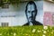 Portrait of Steve Jobs made in the wall of a building