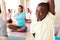 Portrait, stretching and relax, black man in yoga class with smile, commitment and body wellness. Mindfulness, men and