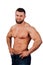 Portrait of a strong bearded male fitness model, torso. White background, isolate. hands on his hips.