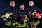 Portrait strong fireman in fireproof uniform holding an ax chainsaw in his hands black background studio.team work