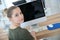 Portrait of student girl in front of computer