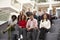 Portrait Of Student Group On Steps Of Campus Building