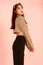 Portrait studio shot of Asian young urban trendy female hipster teenager fashion model in casual crop top street wears jacket