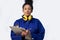 Portrait Of Studio Shot Of Female Engineer With Clipboard And Spanner Against White Background