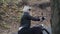 Portrait of stylish model sitting on motorbike in a park