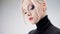 Portrait of a stylish strict blonde in a black turtleneck with stylish eye makeup,