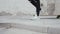 Portrait of stylish teenage young guy riding on the skateboard outdoor. Teenager with a skate board on the street. Sport