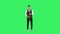 Portrait stylish young guy plays slow melody at saxophone on a green screen in the studio. Saxophonist performing a solo