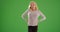 Portrait of successful Caucasian woman smiling at camera on green screen