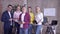 Portrait of successful working team, smiling business male and women during working hours in office