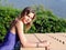 Portrait of summer sunny girl on the tile roof