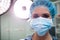 Portrait of surgeon wearing surgical mask in operation room