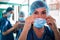 Portrait of surgeon wearing surgical mask in surgical room