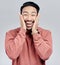 Portrait, surprise and Asian man excited, wow and happiness against a grey studio background. Face, Japanese male and