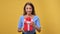 Portrait of surprised woman opening red festive gift box with bow desired present posing isolated