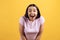 Portrait of surprised young girl in pink tshirt.