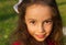 Portrait of Sweet little girl outdoors with curly hair