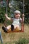 Portrait of swinging baby