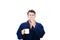 Portrait of tardy young man wears blue bathrobe holding cup of coffe and yawning unable to wake up in time to get to work,