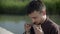 Portrait tea sniffing tea leaves oolong on outdoor ceremony. Relaxed man enjoying green tea aroma on chinese ceremony in