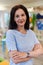 Portrait of a teacher in a preschool institution, in the background of the classrooms