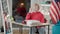 Portrait of teen Asian girl sitting at desk at home thinking. Thoughtful teenage student with dyed blond hair doing