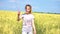 Portrait of teen female with balloons having fun in field