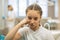 Portrait of teen girl with the sceptical look in the dental clinic