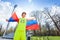 Portrait of teenage runner waving Russian flag