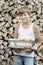 Portrait of teenage woodcutter at firewood